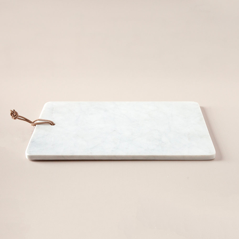 Marble cheese board with leather cord.