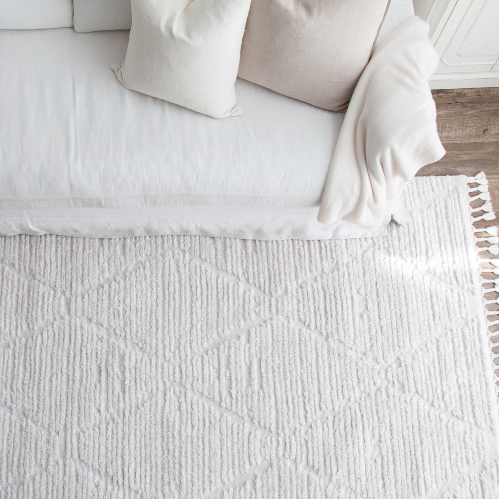 Off white rug with plush pile.