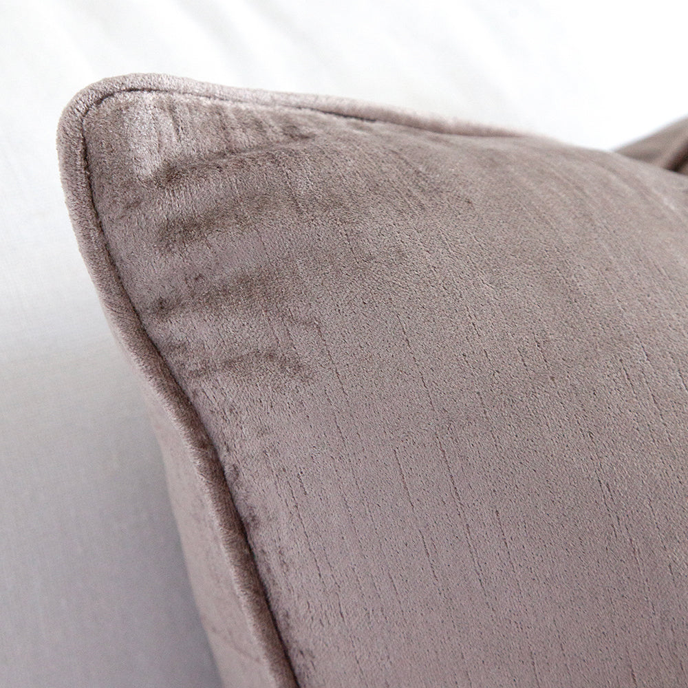 Close up detail of mauve velvet cushion.
