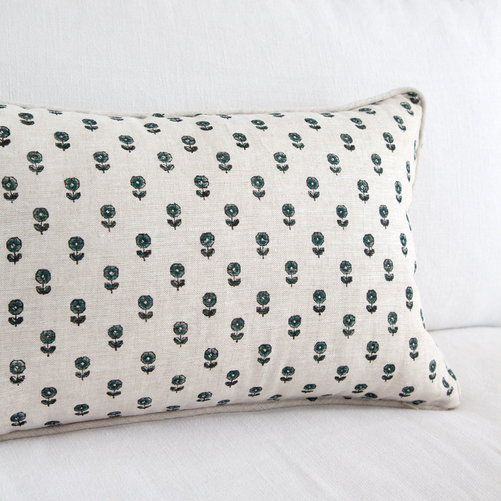 Daisy pattern repeat on rectangle cushion.