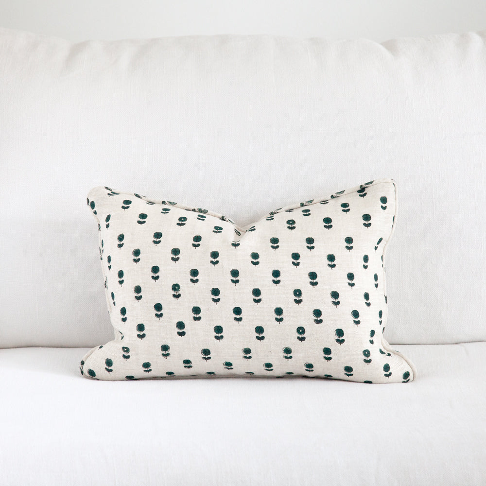 Daisy design on a natural linen cushion.