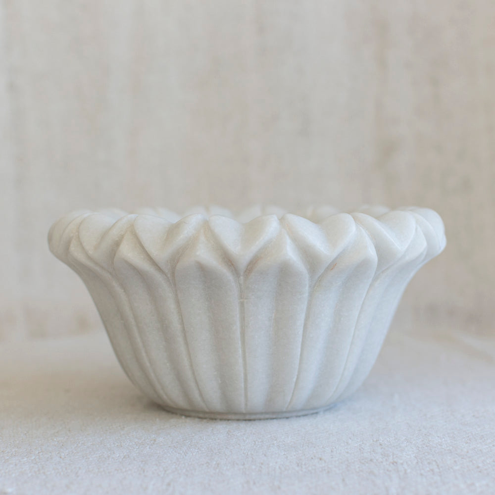 Marble bowl with lotus flower shape.