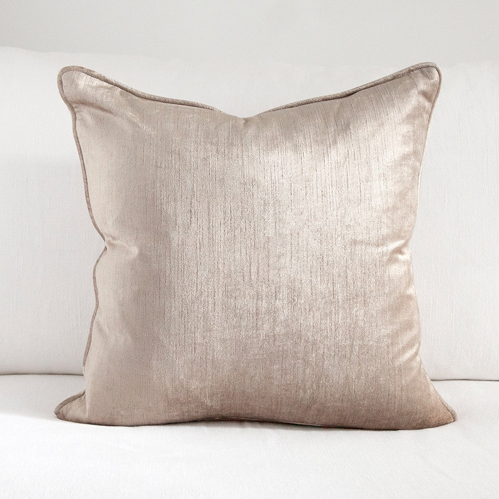 Warm grey square velvet cushion with piped edging.