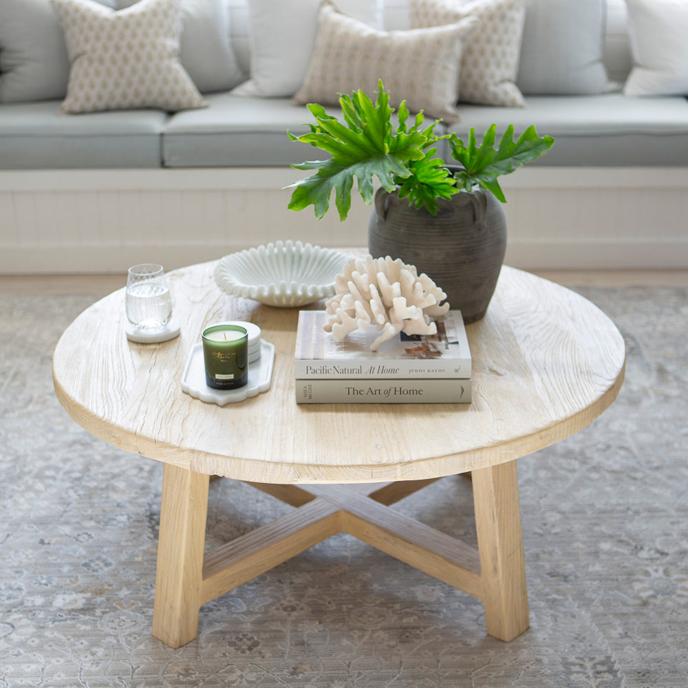 Round coffee table made from recycled elm wood. 