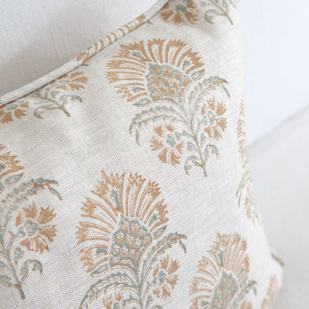 Close up of the design sea Holly block printed design on a rectangular linen cushion. 