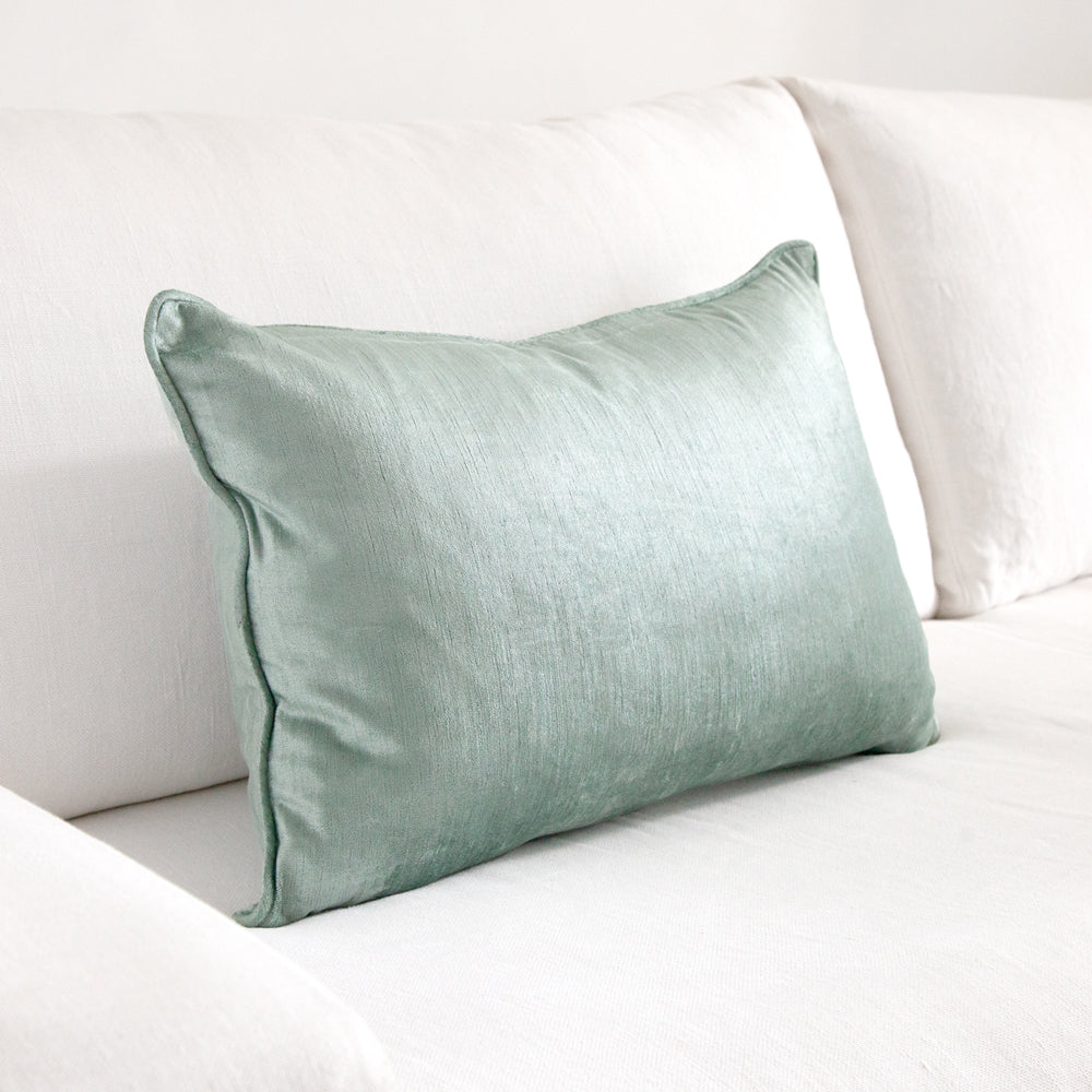 Aqua teal blue green rectangular velvet cushion.