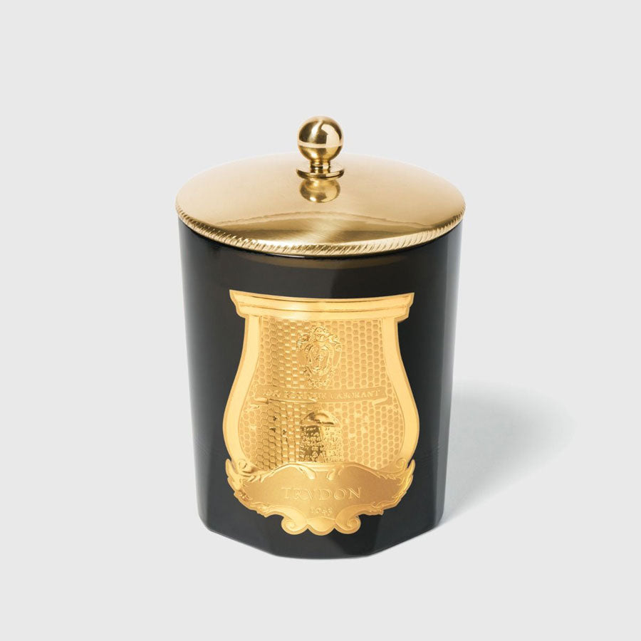 Trudon Brass candle topper on classic candle.