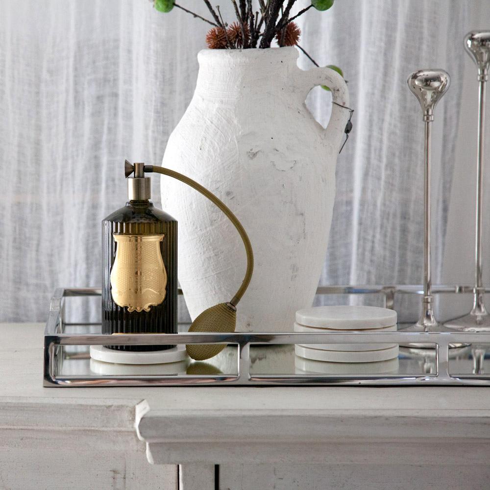 Trudon room spray styled on console table.