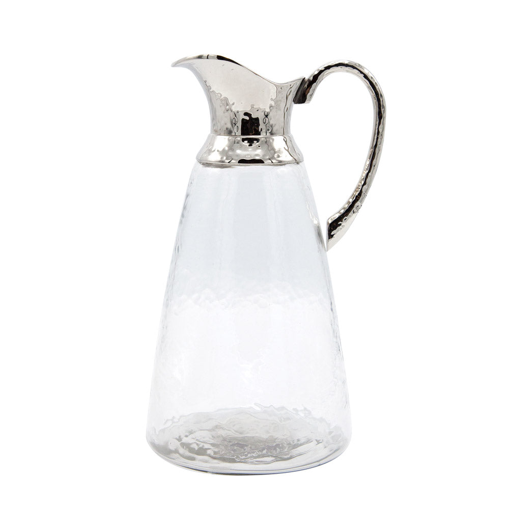 Classic glass water jug with silver top.