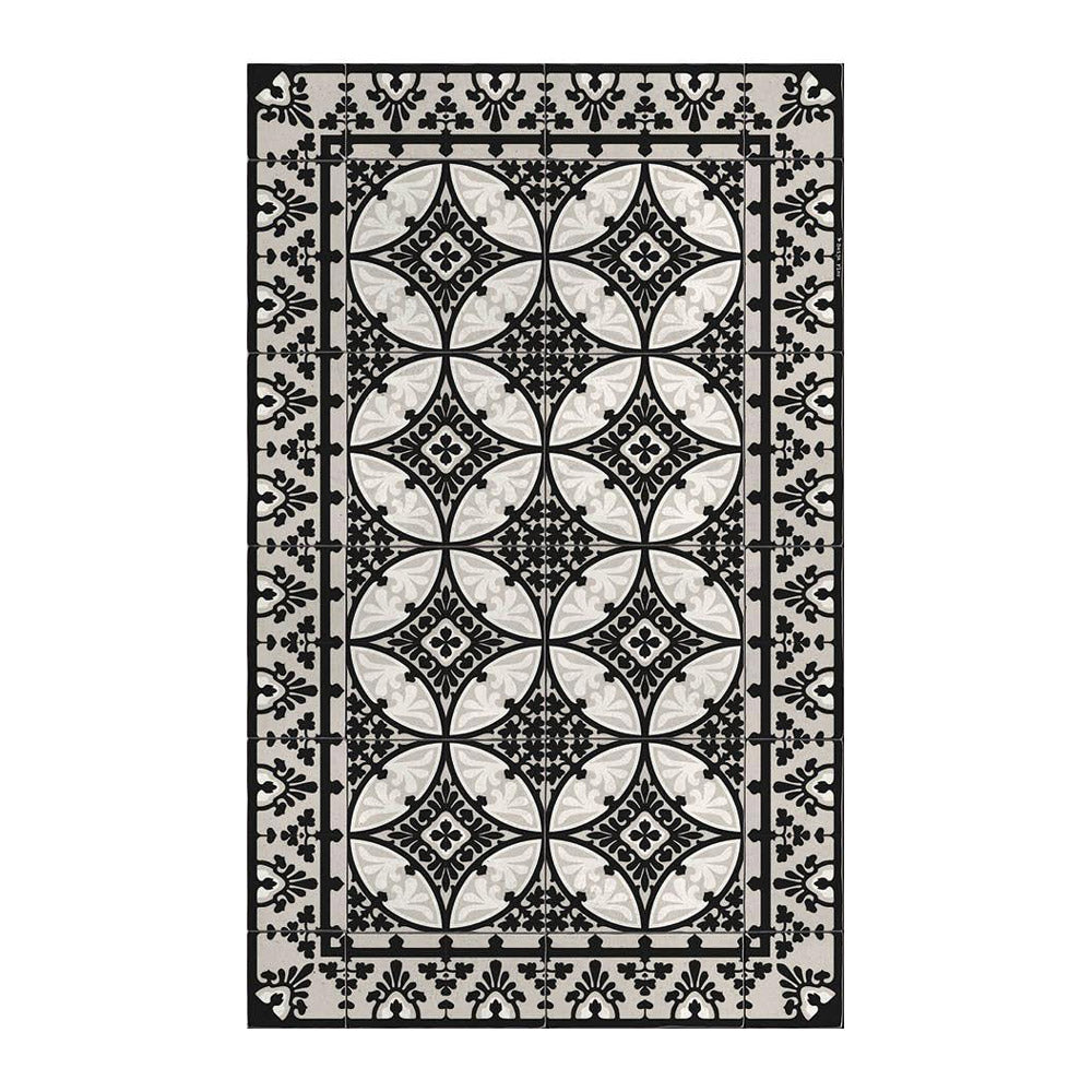 Vinyl floor mat featuring black, white and grey tile design.