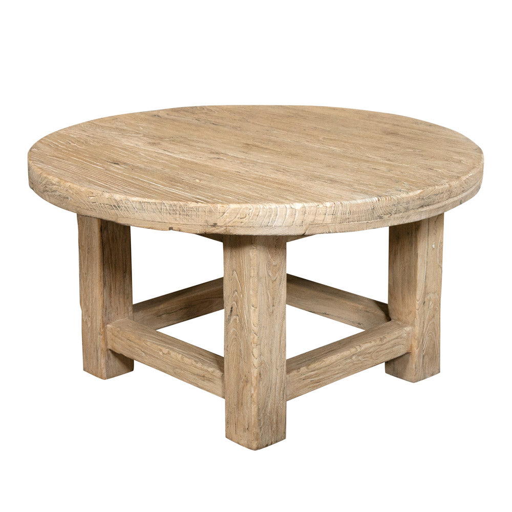 Round coffee table made from rustic wood.
