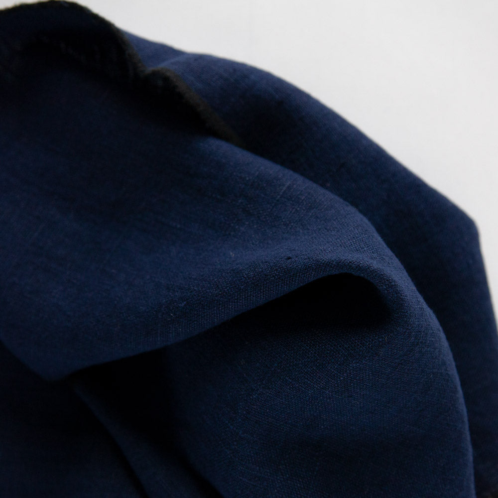 Close up of dark blue linen tea towel.