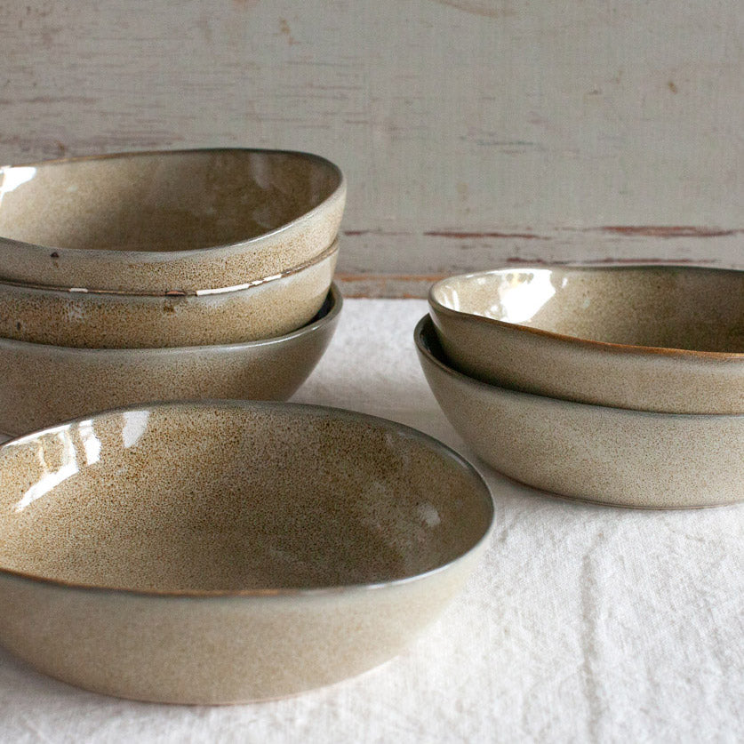 Stack of ostrich coloured breakfast bowls.