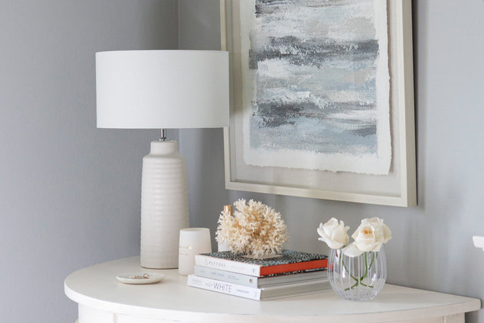 Abstract blue art hung on a wall 