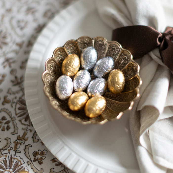 Easter eggs in a brass serving dish.