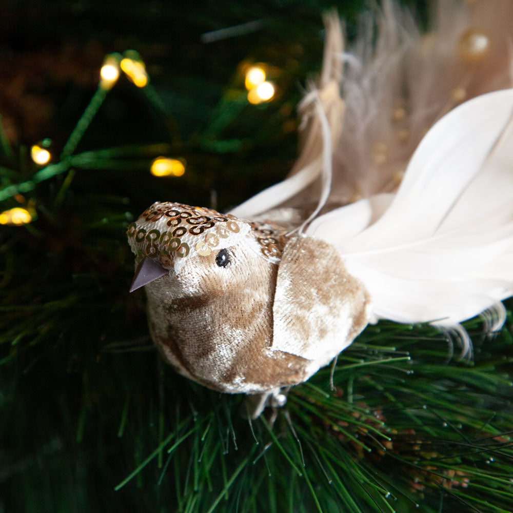 Champagne coloured bird christmas decoration clip on Christmas tree. 