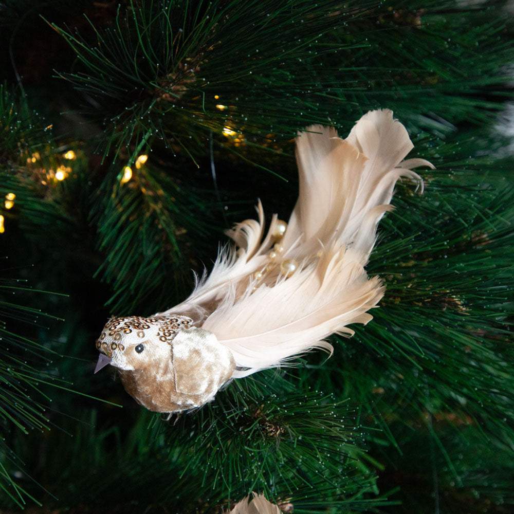Champagne coloured bird christmas decoration clip on Christmas tree. 