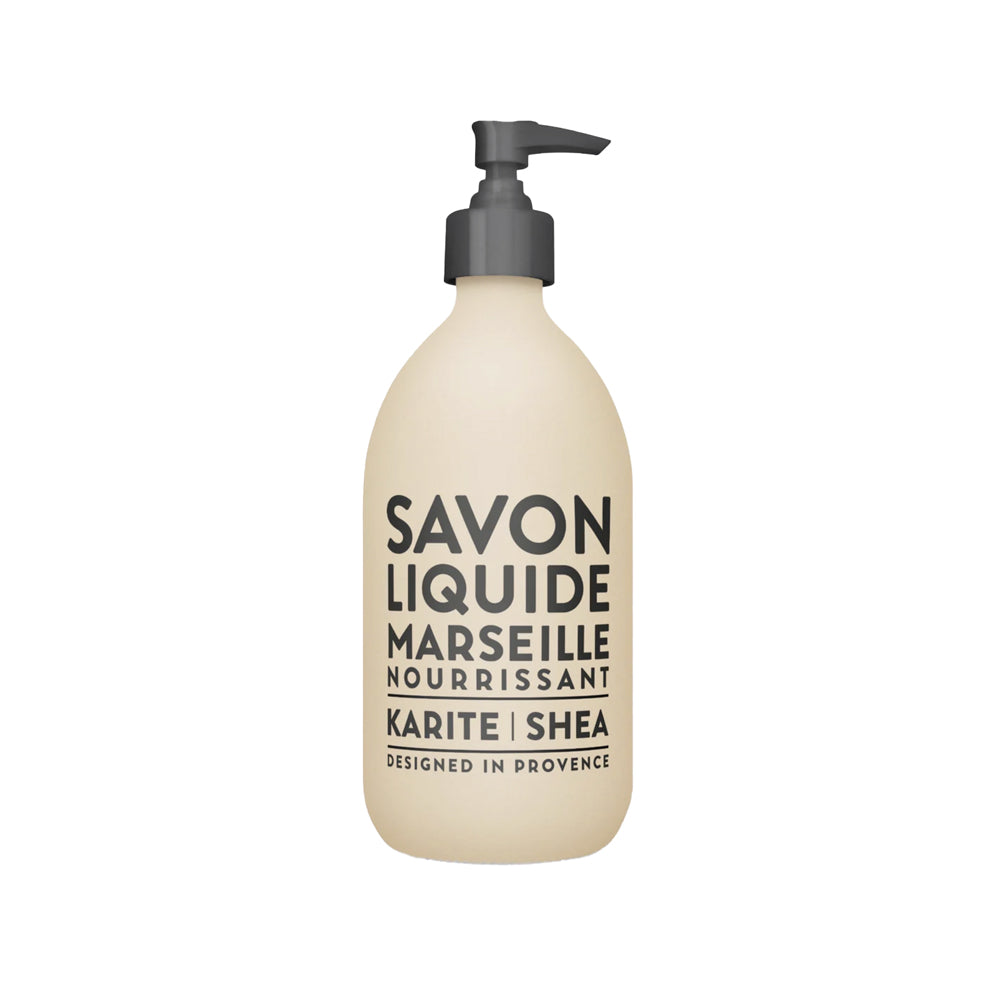 Beige coloured liquid soap bottle with black text and black pump top.