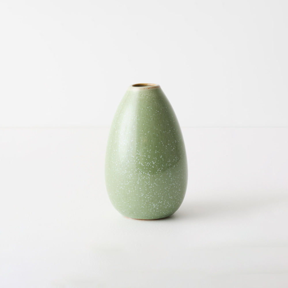 Small green ceramic bud vase.