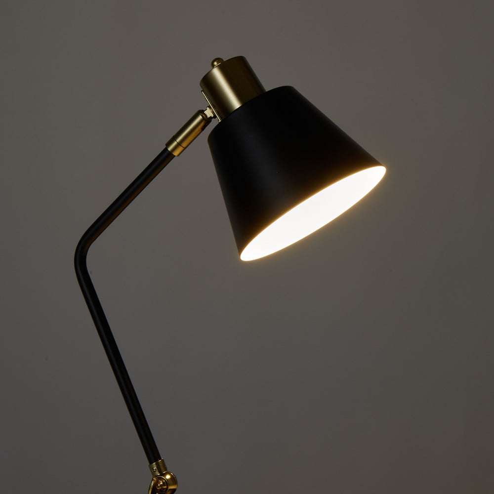 Black and brass desk lamp.