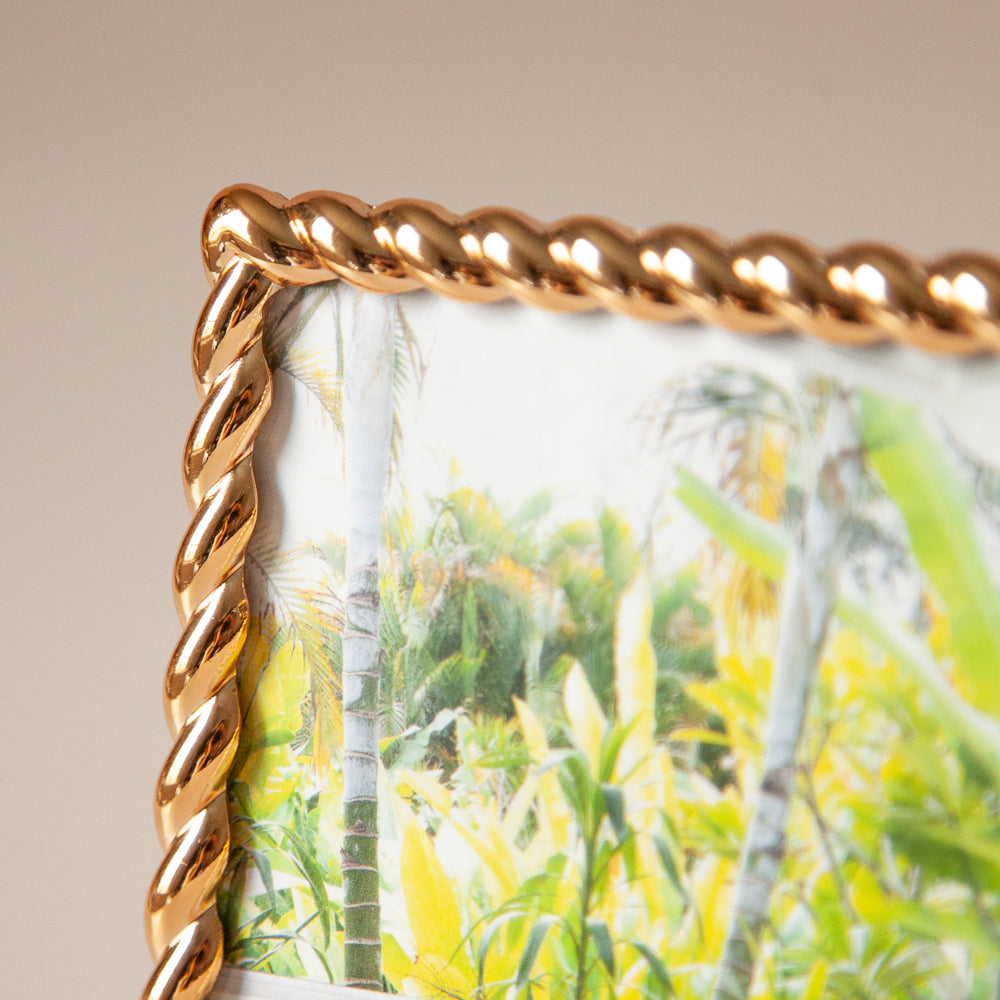 Gold edged photo frame close up.