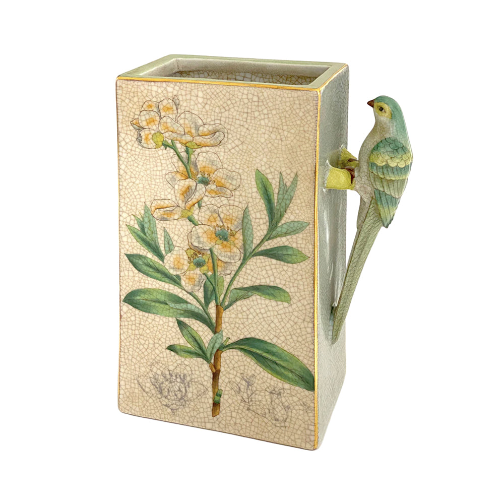 Rectangular porcelain vase with floral design printed on the front and a bird hanging off the side of the vase.