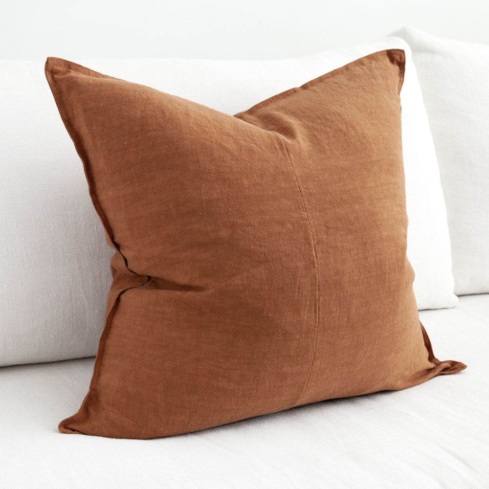 Large amber coloured linen cushion.