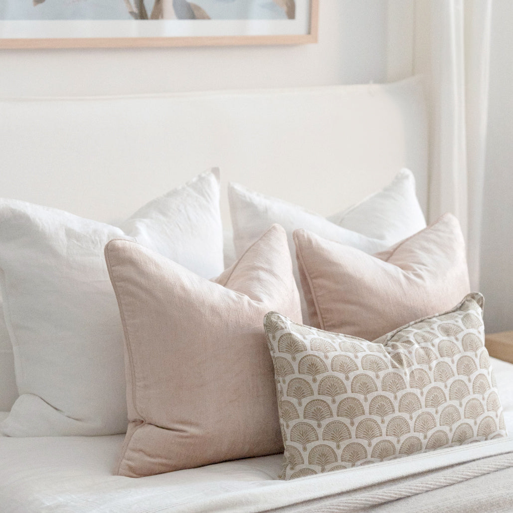 Walter G and pink velvet cushions on bed.