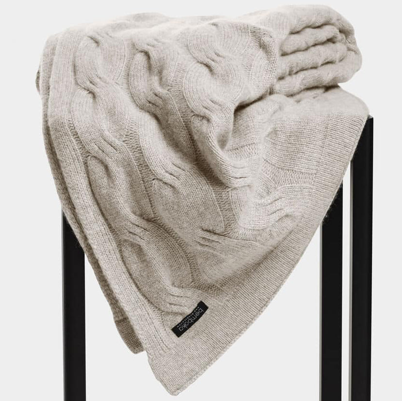 Bemboka Cashmere Chunky Cable Knit Throw in Sand colour.