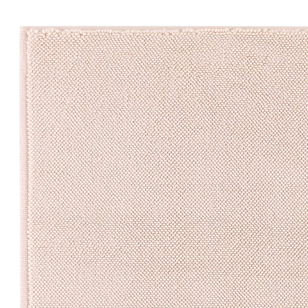 Close up of Bemboka micro cotton bath mat in blush pink.