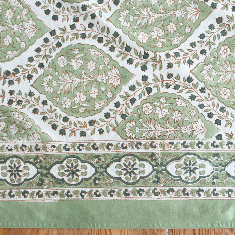 Green block printed tablecloth.