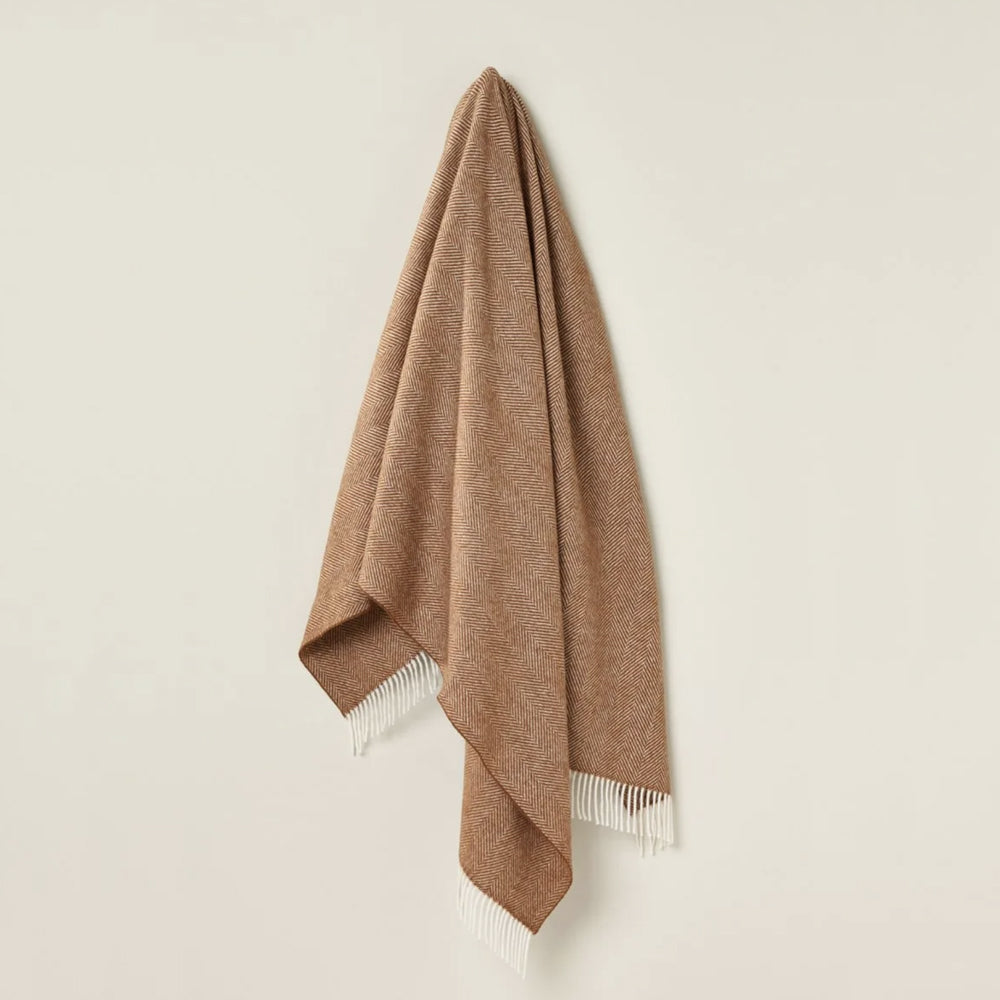 Bronte by Moon rust herringbone throw.