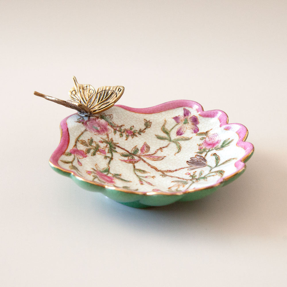 Pink and green floral soap dish with bronze butterfly.