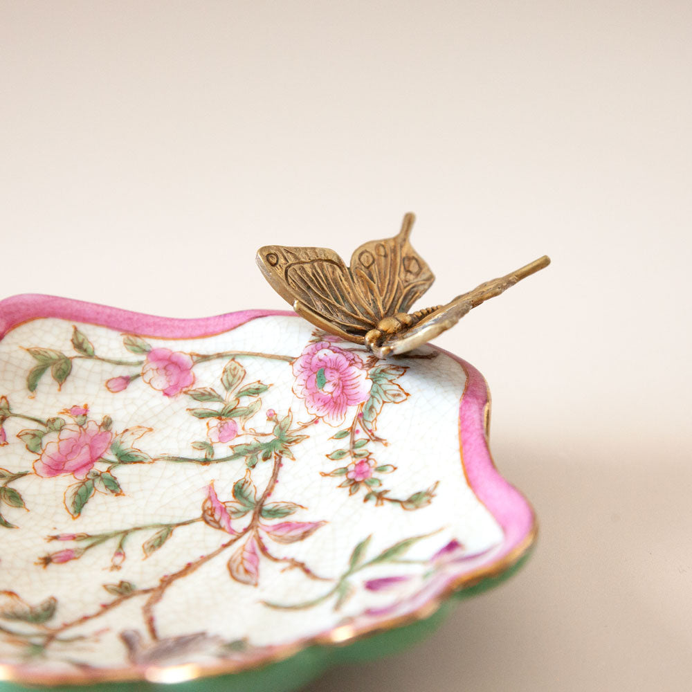 Pink and green floral soap dish with bronze butterfly.