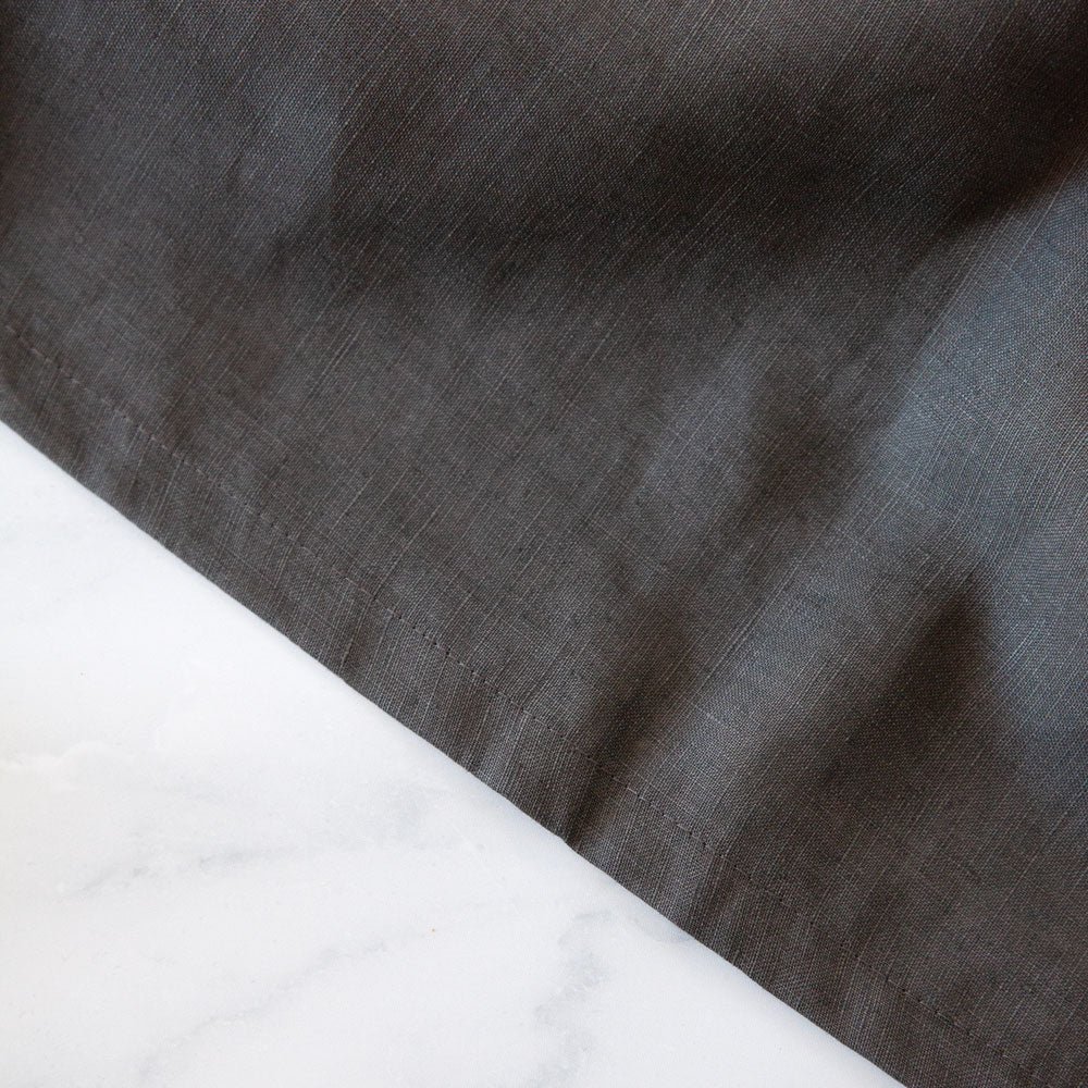 Close up of charcoal linen tablecloth.