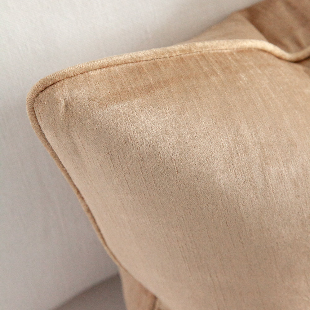 Close up of fabric on velvet cushion.