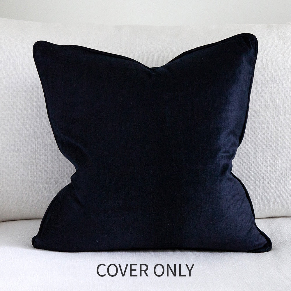 Dark navy blue square velvet cushion.