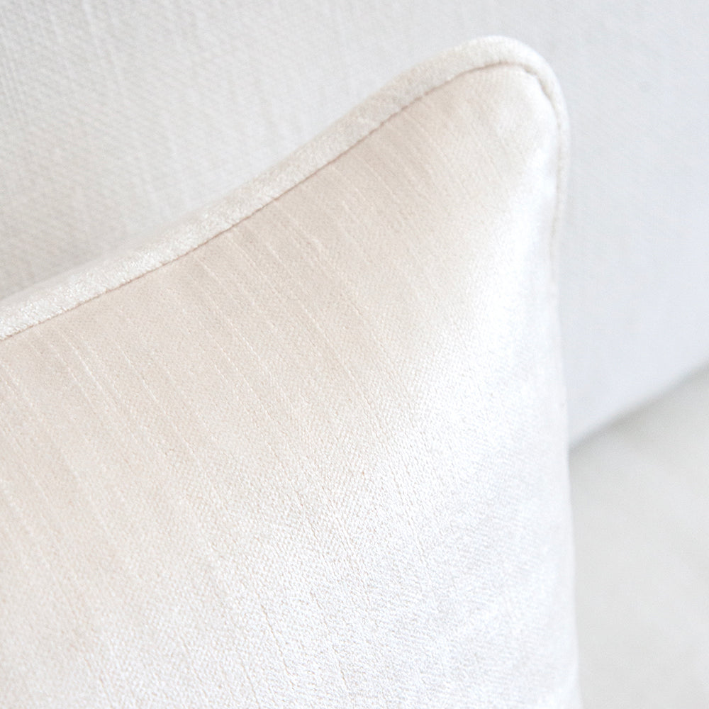 White velvet cushion close up.