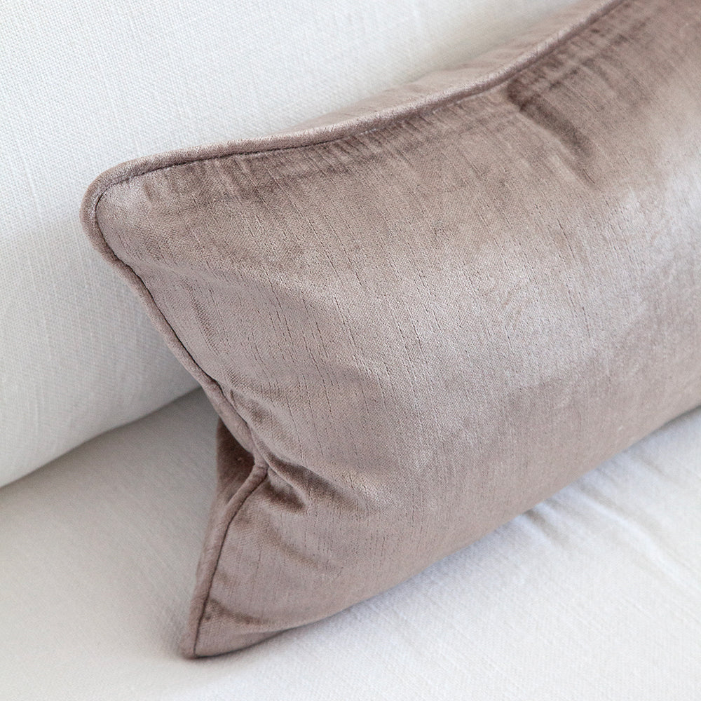Close up of mauve velvet cushion.