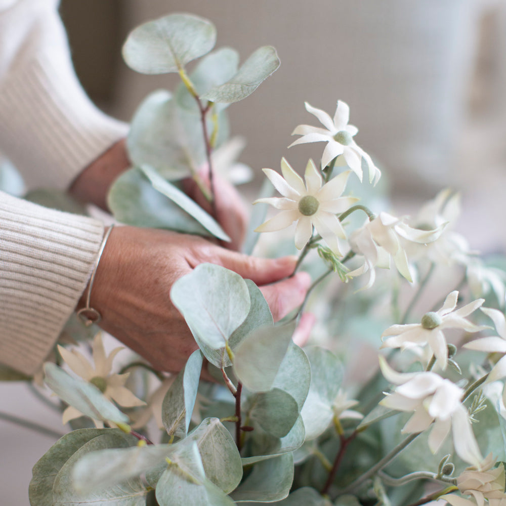 Artificial flannel flowers with eucalyptus.