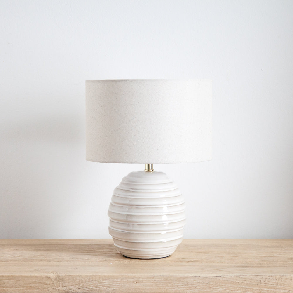 Small ceramic lamp with linen shade. 