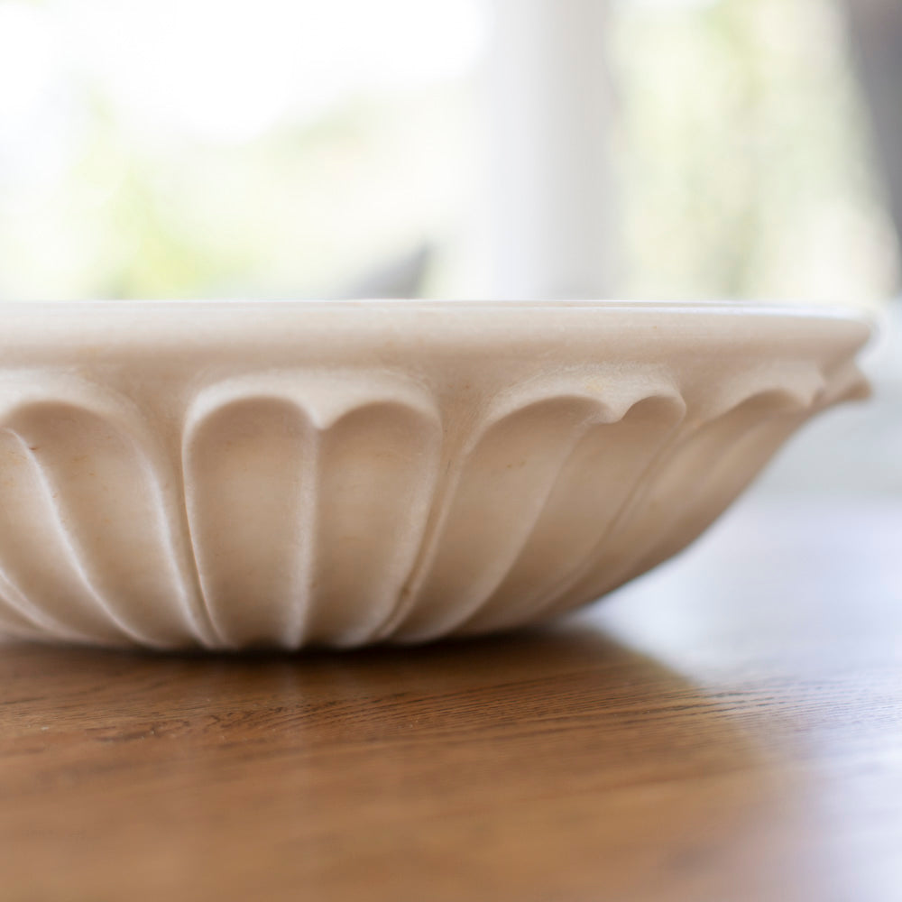 Large marble bowl with petal design.