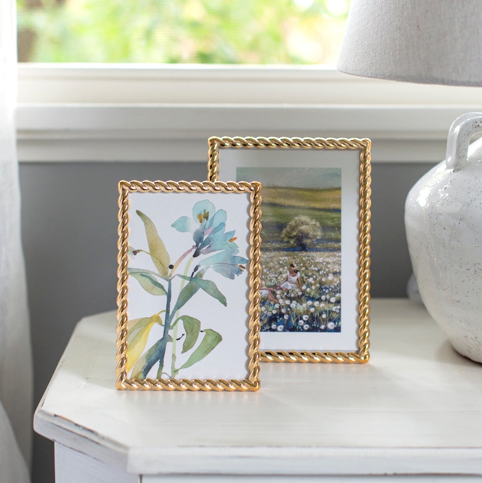 Gold edged photo frame in two sizes.