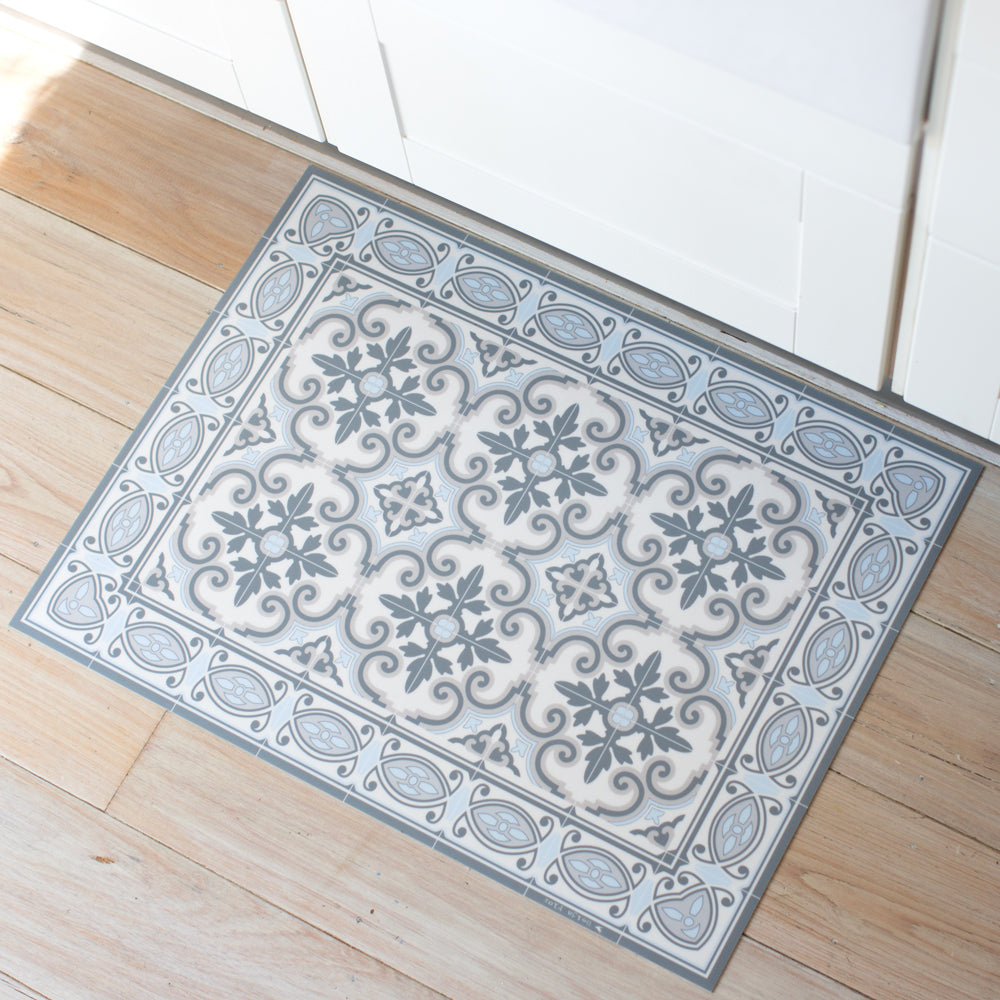 Blue and grey vinyl floor mat in the kitchen. Spanish tile design.
