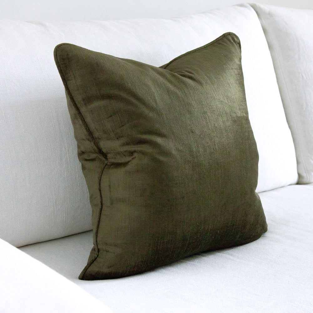 Square green velvet cushion cover.