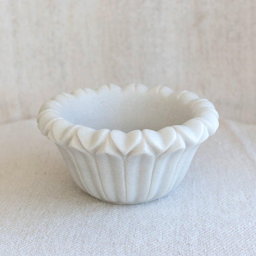 Marble bowl with lotus flower shape.