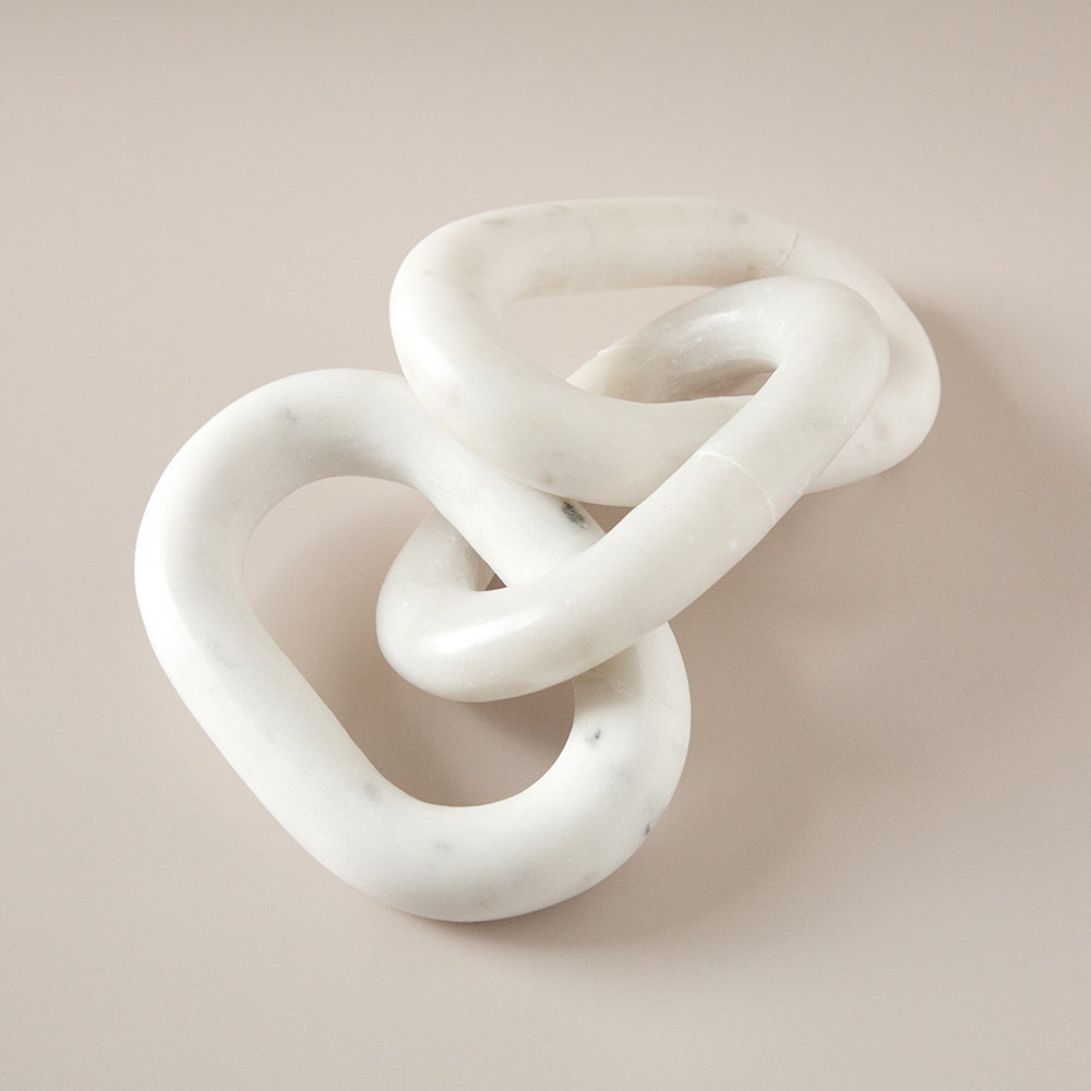 White marble chain sculpture.