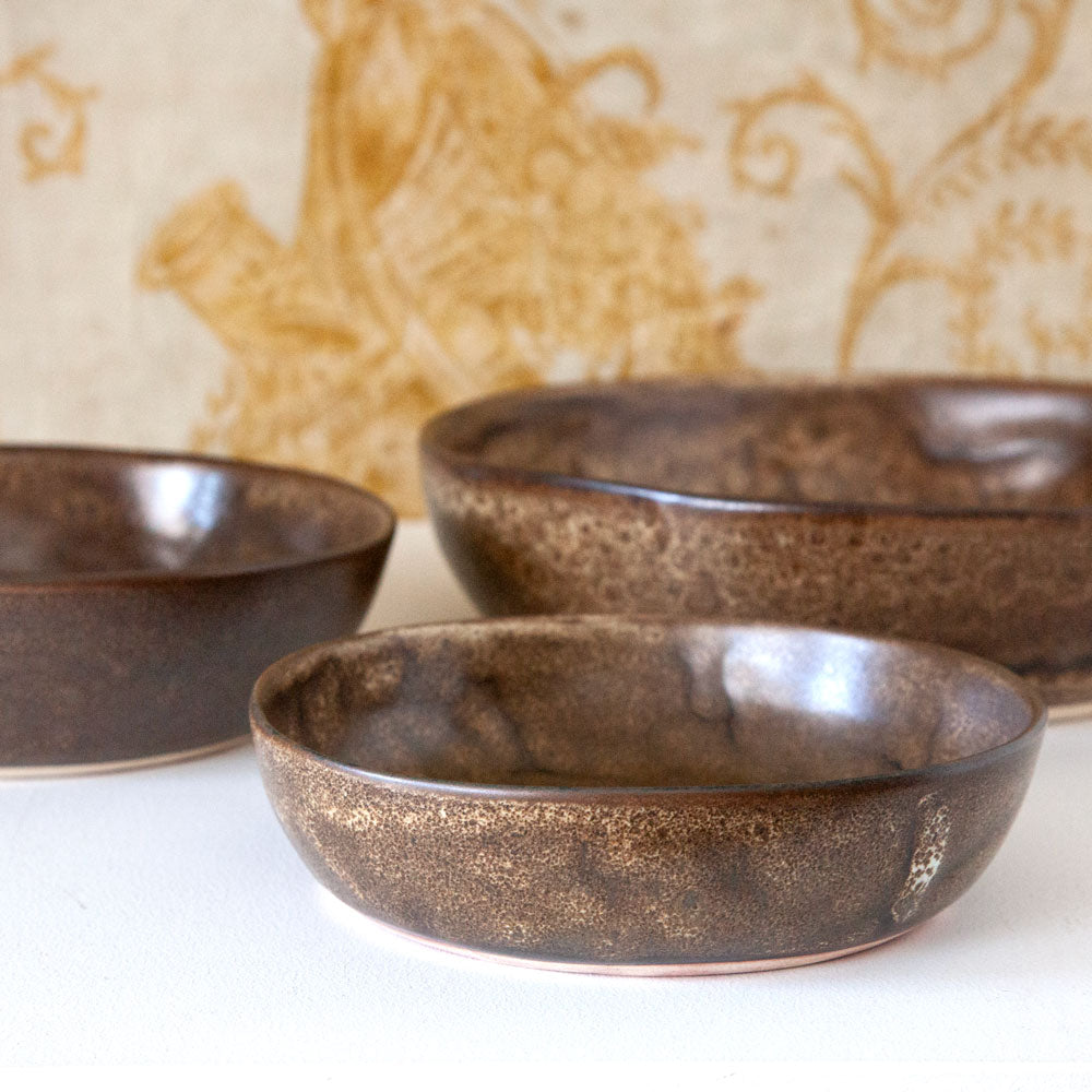 Brown ceramic Mervyn Gers bowls.