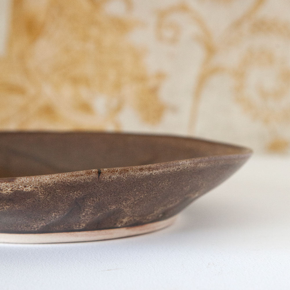 Close up of Mervyn Gers brown ceramic pasta bowl.