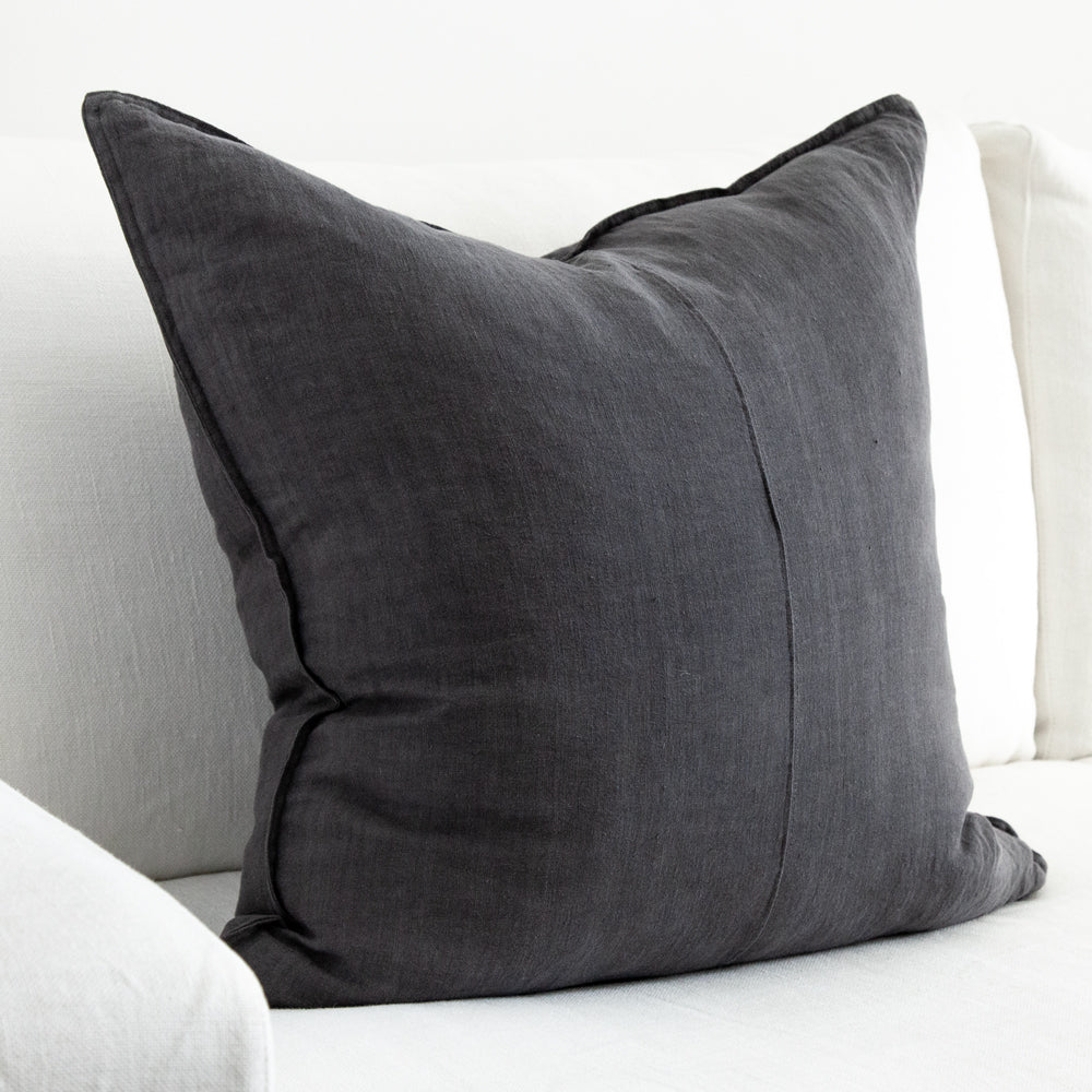 Large square charcoal linen cushion.